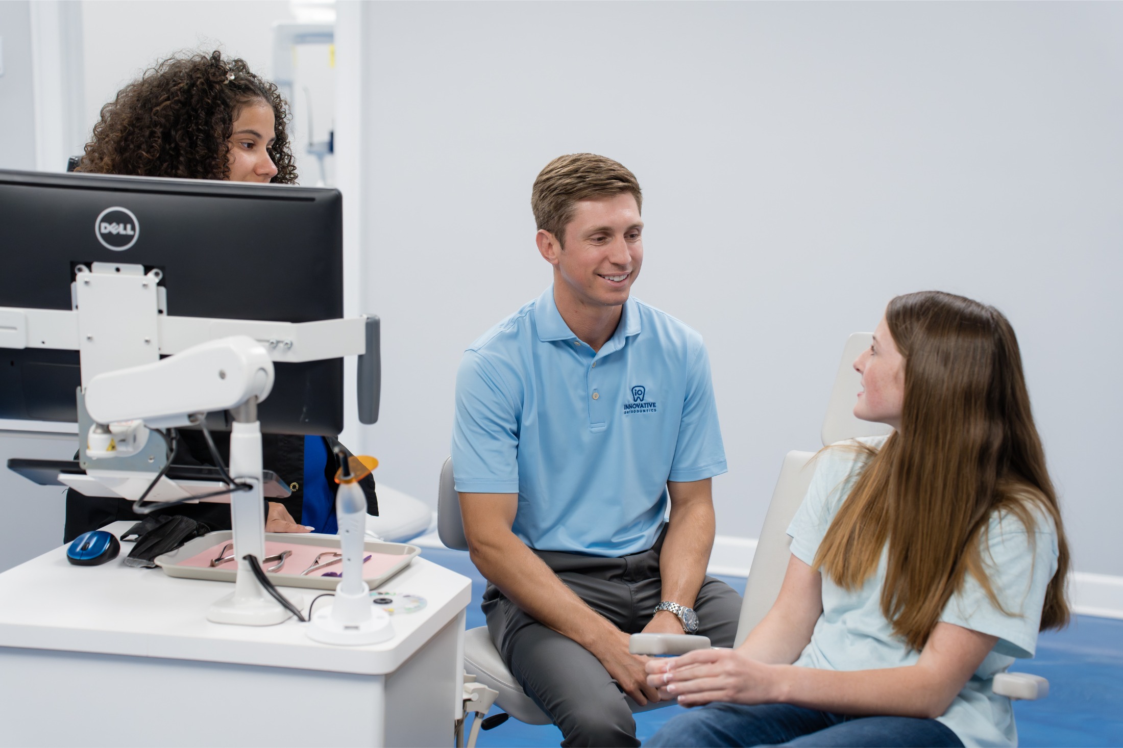 Innovative Orthodontics consultation with patient and orthodontist discussing treatment options.